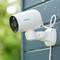 Security camera mounted on an external wall, facing left to monitor the premises.