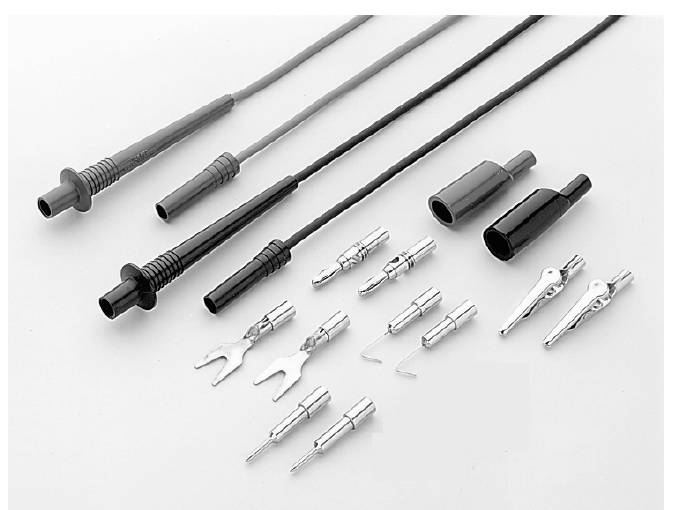 Electronic Accessories: Several black cables and silver plugs in various shapes and sizes, arranged on a white background.