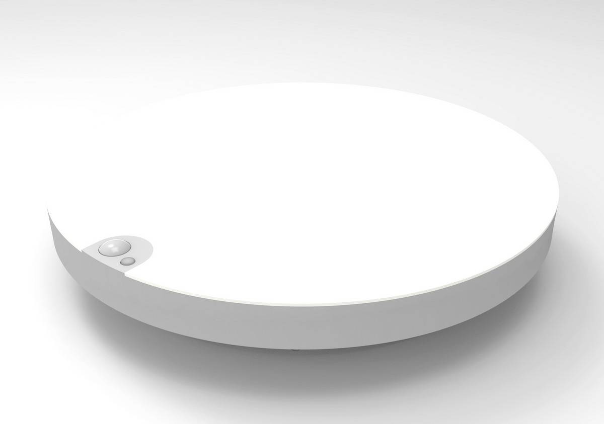 Round, flat white object with a small, raised button on the side. Could be an electronic device.