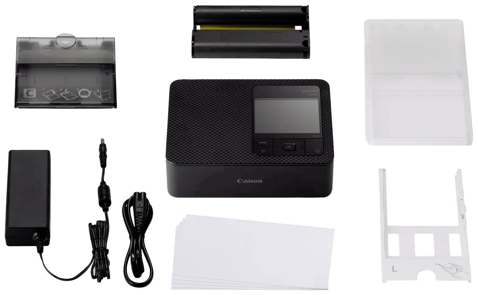 Set with a compact printer, paper, power supply, paper cassette, and printer cartridge.