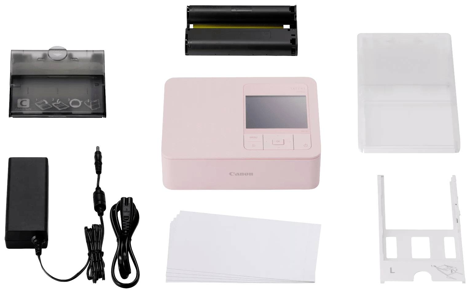 A pink photo printer with accessories: power supply, paper, paper cassettes, and colour ribbon. Suitable for instant photo printing.