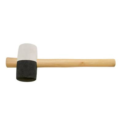 A rubber mallet with a white head and black base is lying horizontally. The wooden handle is visible. A tool for light construction work.
