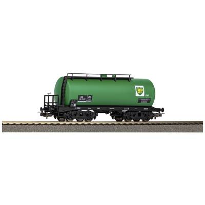 Green BP tanker wagon on a model railway track, detailed view of labelling and chassis.