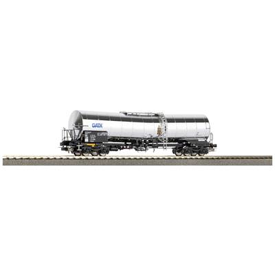 A silver tank wagon from the GATX brand is standing on a railway track. The wagon has black and grey details, including ladders and hoses.