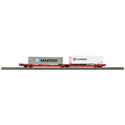 A red goods wagon on railway tracks is transporting two containers, one from 'MAERSK' and one from 'DB Schenker'.