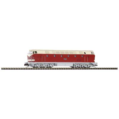 Red and beige locomotive on railway tracks, viewed from the side.