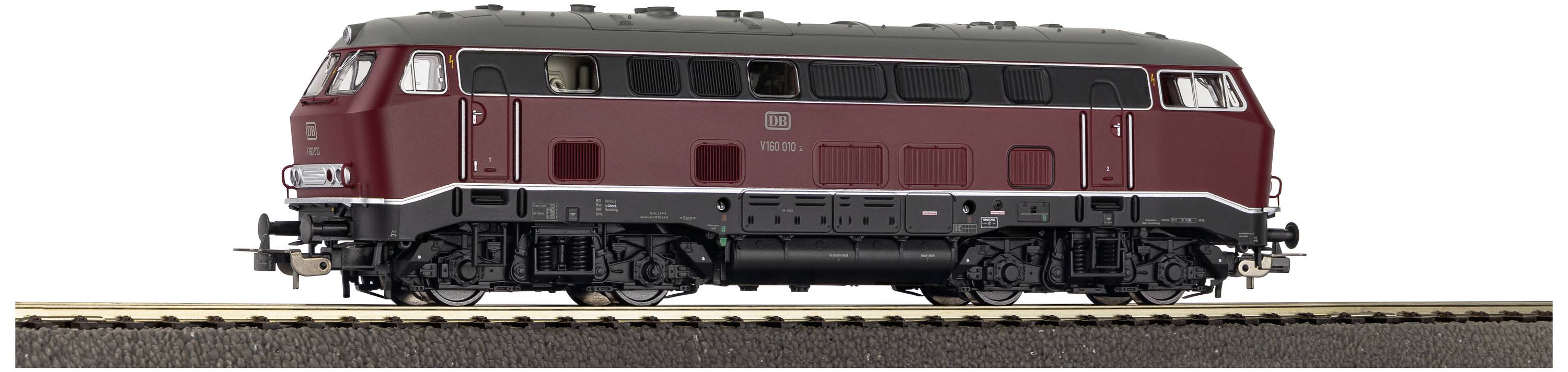 A model train of the Class 218 in dark red is standing on a track. It has a detailed design with visible wheels.