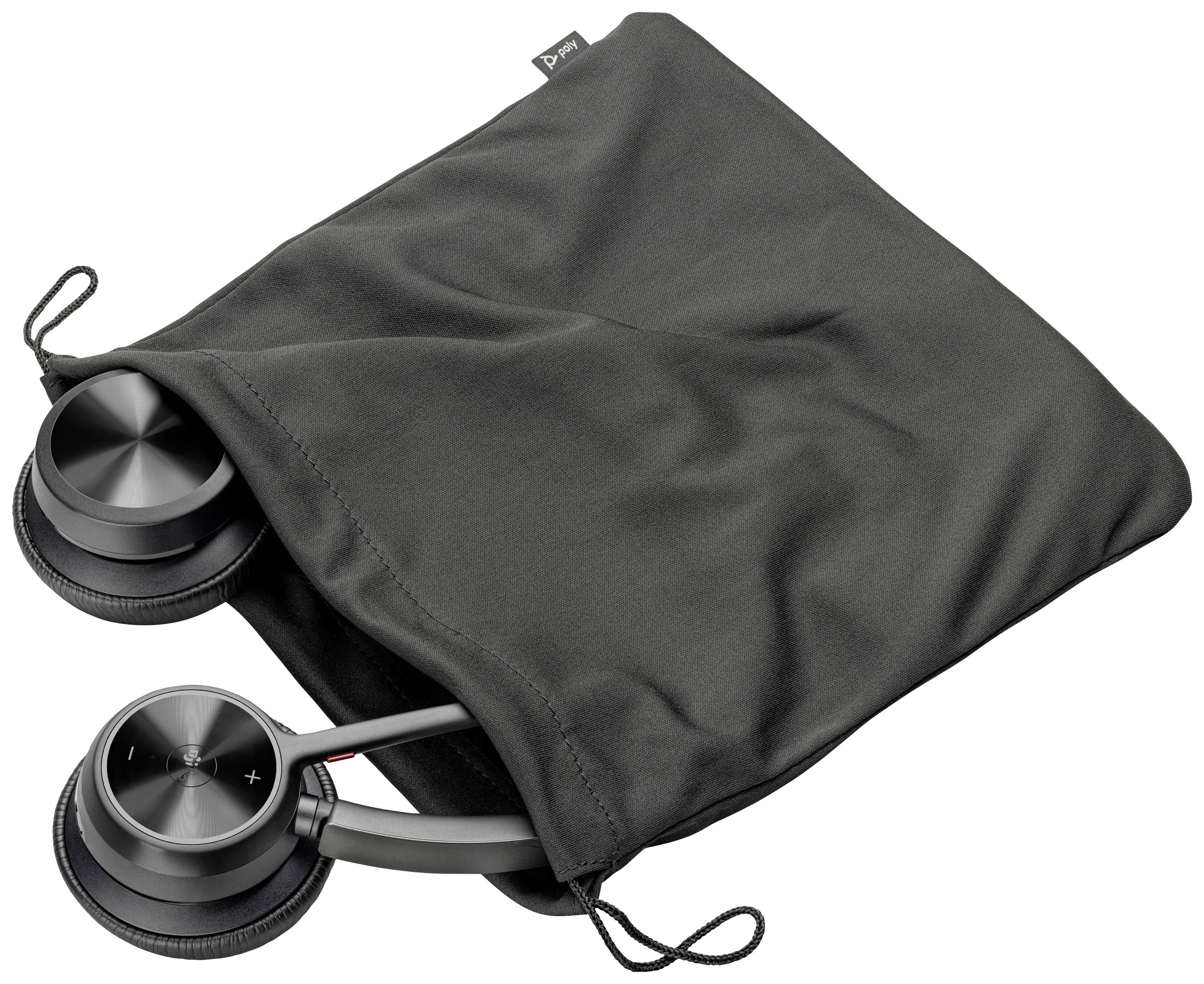 Black headphones partially in a black fabric bag, with volume indicator visible on the ear cup.