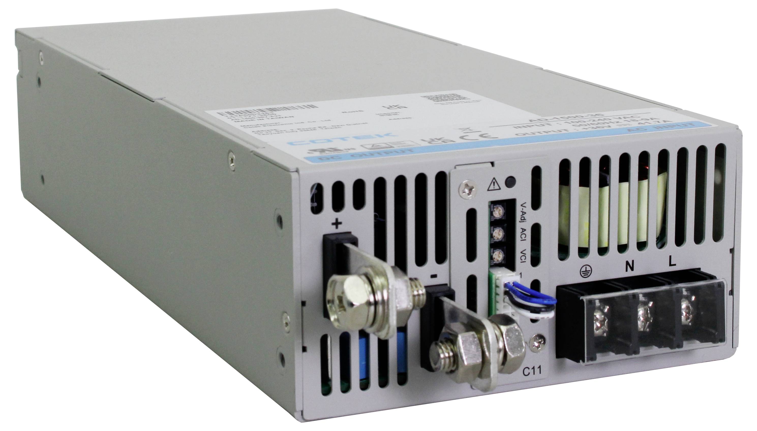 Power supply unit with housing, ventilation slots, and connection terminals.