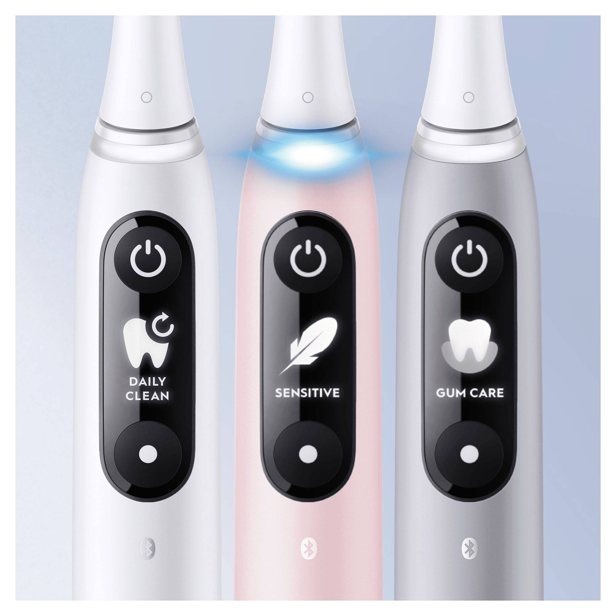 Three electric toothbrushes with different modes: 'Daily Clean', 'Sensitive', 'Gum Care'. Each has its own display screen.