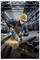 A worker in a factory grinds a steel beam with a power tool, causing sparks to fly. He wears safety gear, including gloves, goggles, and a helmet.