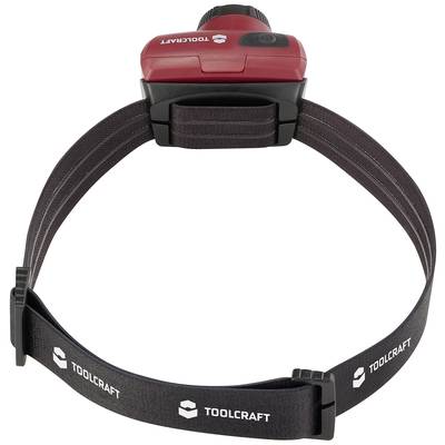 Headlamp by Toolcraft, black and red design, adjustable elastic strap with 'TOOLCRAFT' printed text. Ideal for hands-free tasks.