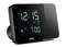 Digital alarm clock shows 12:15 and an set alarm time of 7:00. 'AM' and 'DST' symbols visible.