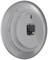 Round smoke detector with removable back panel and battery holder, showing a grey housing construction.