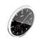 A silver analogue watch with a black dial displays the time as 10:10. Two smaller dials show the date and temperature.