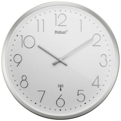 A round, white wall clock shows 10:10. It has silver hands and Arabic numerals. The 'Mebus' brand is displayed on the dial.
