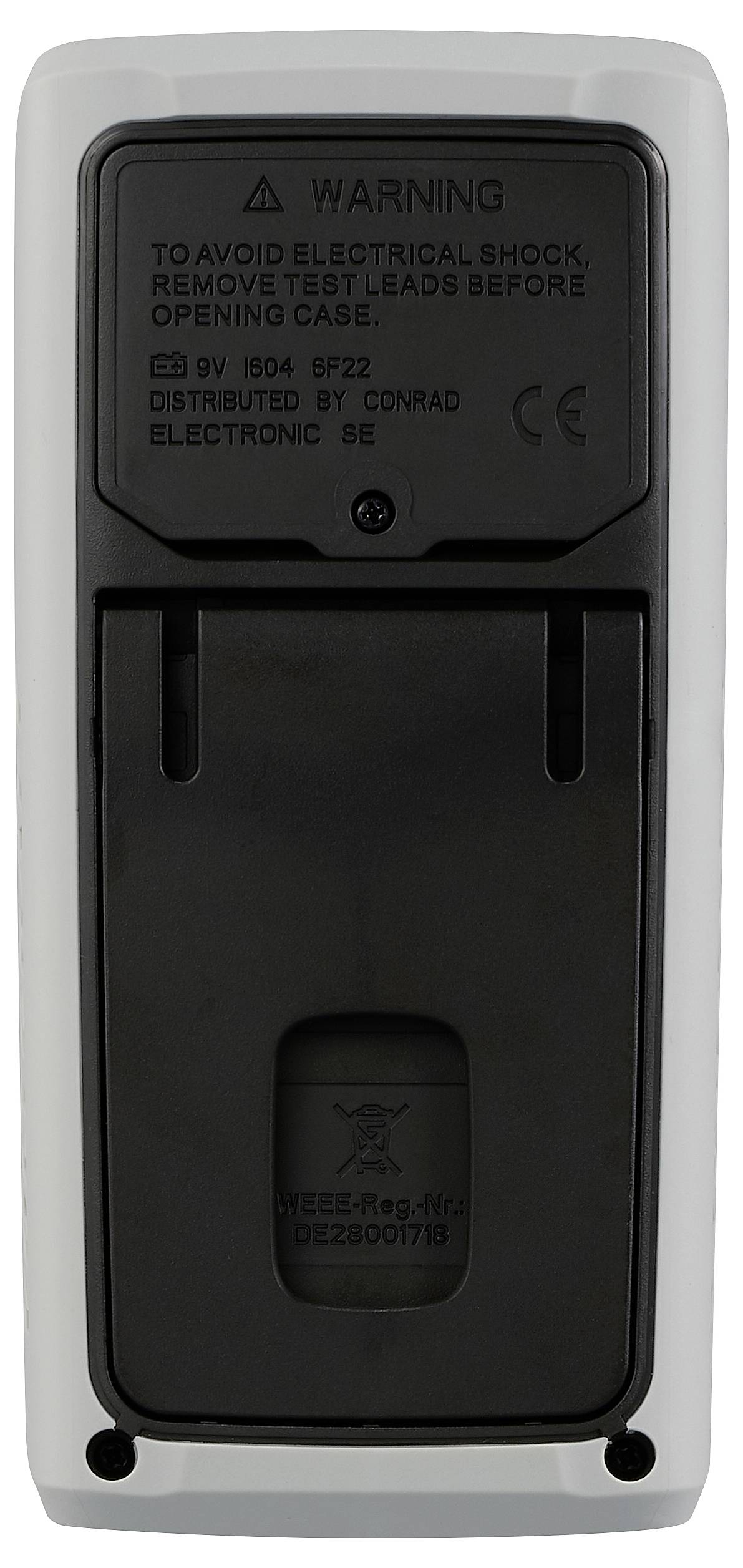 Back of an electronic device with warning notice: 'Remove test leads before opening to avoid electric shock.'