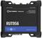 'TELTONIKA RUT956' black network router, compact rectangular box with antenna connections on top.