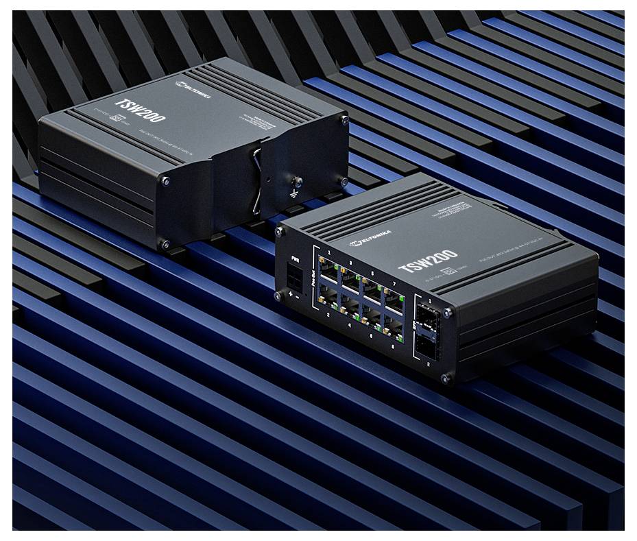 Two black TSW200 network switches on a blue-and-black striped surface, one showing Ethernet ports on the front panel.