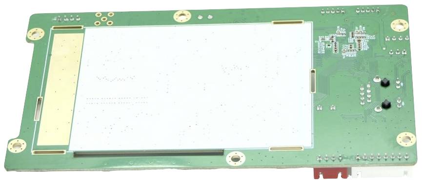 Green printed circuit board with electronic components and connectors, primarily rectangular with multiple holes and plug connections.
