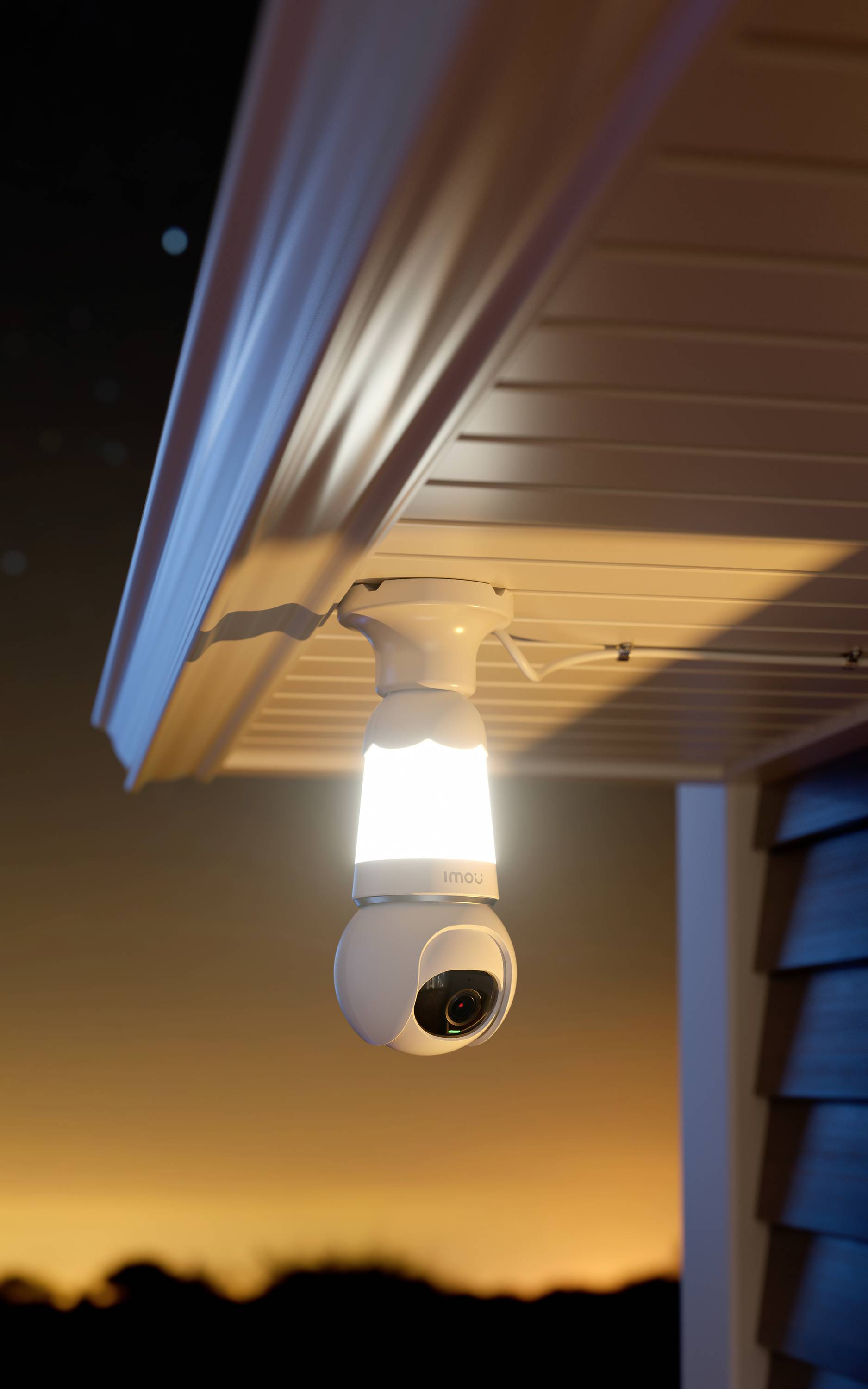 Surveillance camera mounted under an eaves at sunset, ready to monitor an external area.