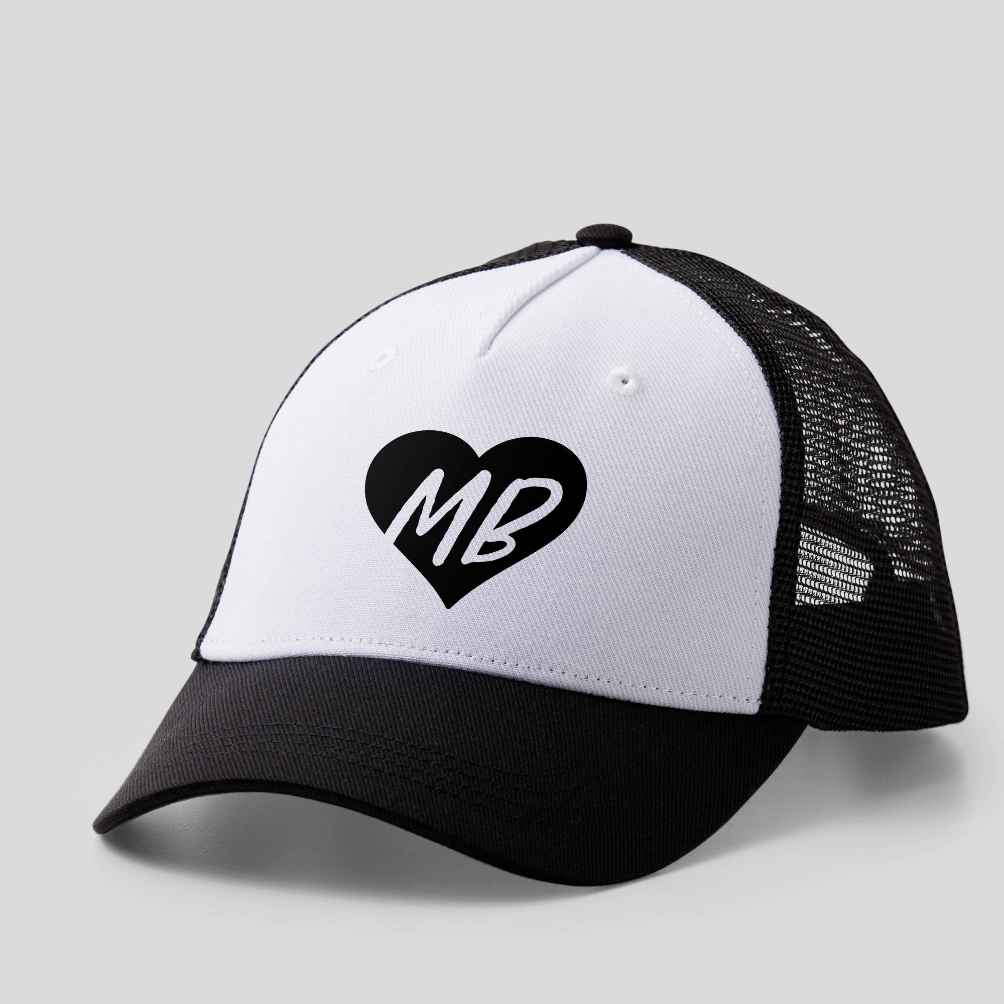 White cap with a black brim, featuring a black heart with the letters 'MB'.