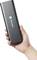 A hand is holding a black, rectangular device by the brand Toolcraft.