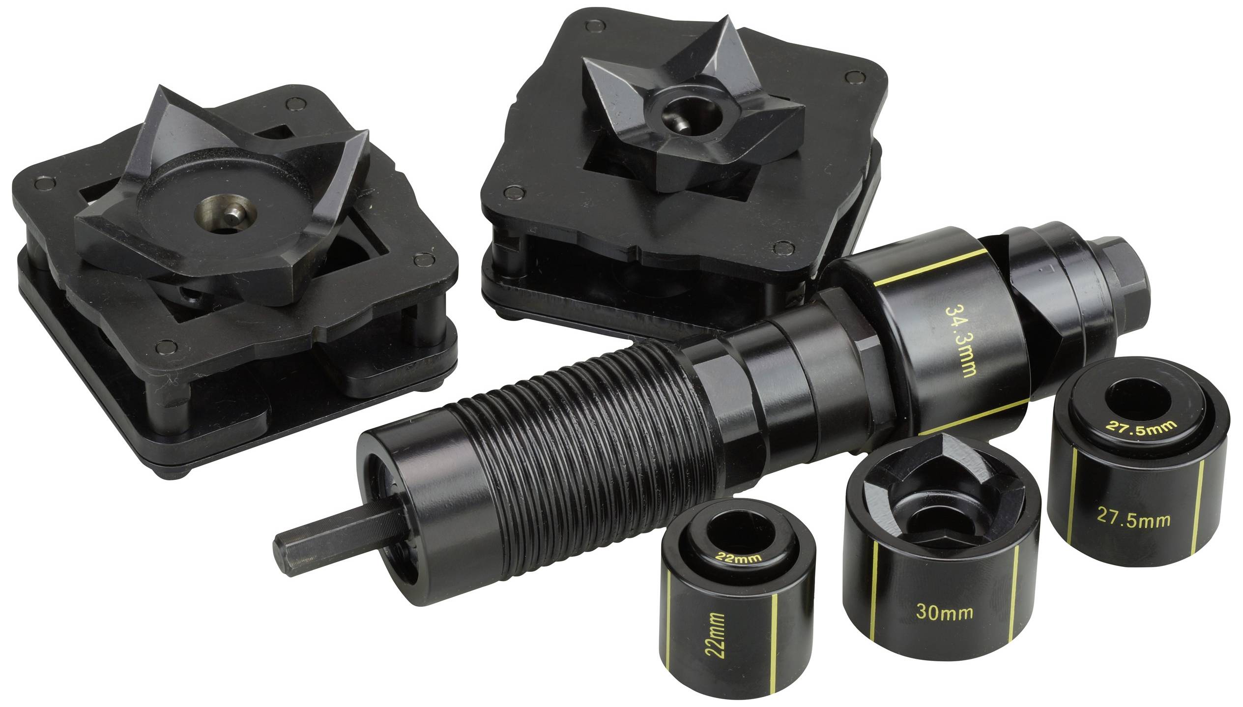 A set of various tools and accessories for an automotive workshop, including spacers and adapters in different sizes.