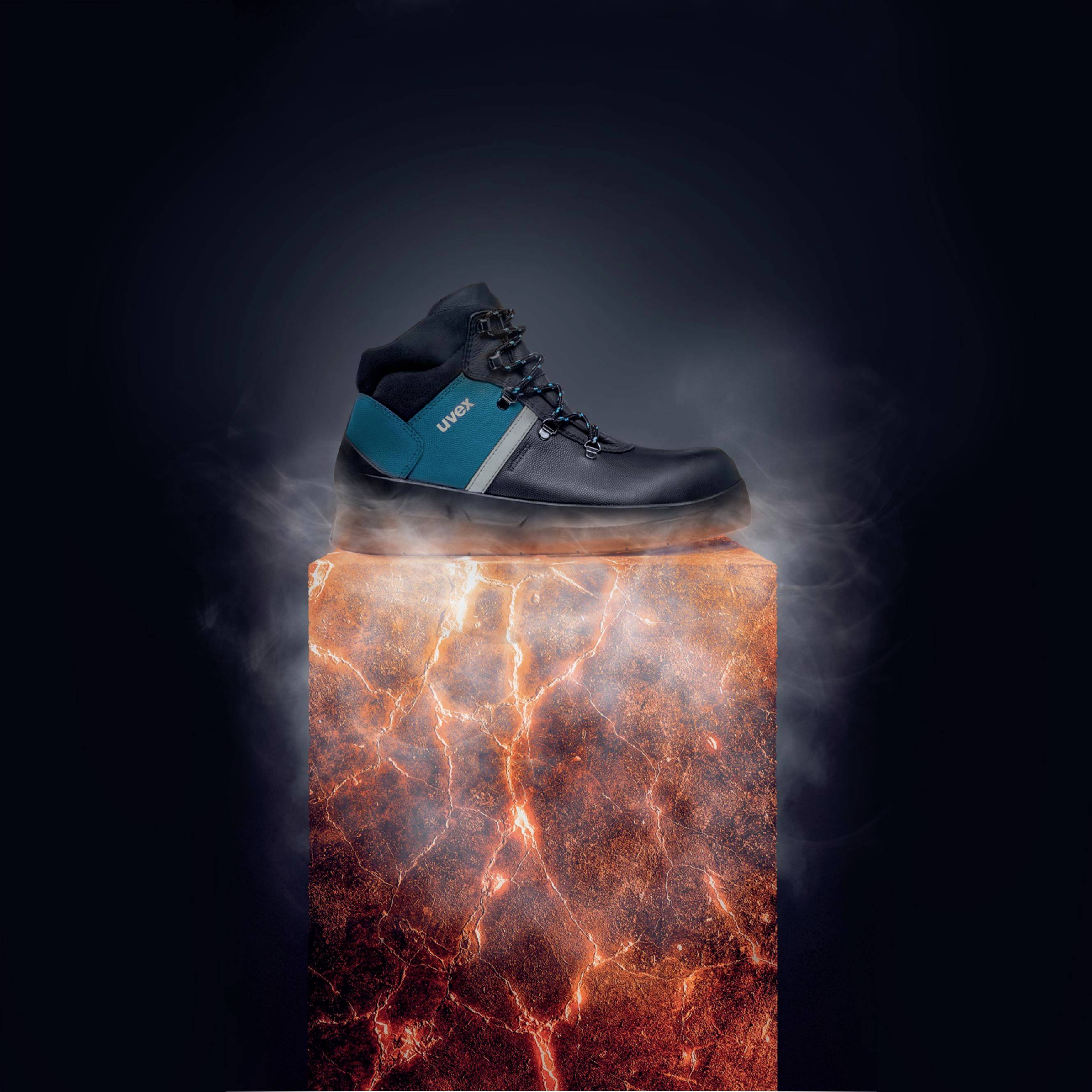 'A black, robust work shoe hovers above a luminous orange, smoking plinth that looks like lava.'