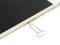 A smartphone is lying flat, with a SIM card ejection tool inserted in the slot to remove the SIM card.