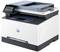 Multifunction printer on a table, with a touchscreen control panel; compact and suitable for office applications.
