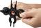 A person is holding a black, multifunctional tool specifically designed for work on solar cables and connectors.
