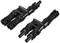 Two black plastic connectors, lying side by side, each with two plug connections. Used for electrical connections.
