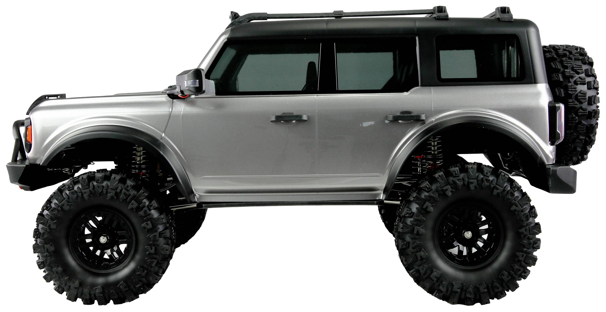 A silver off-road vehicle with high, chunky tyres, suitable for off-road adventures.