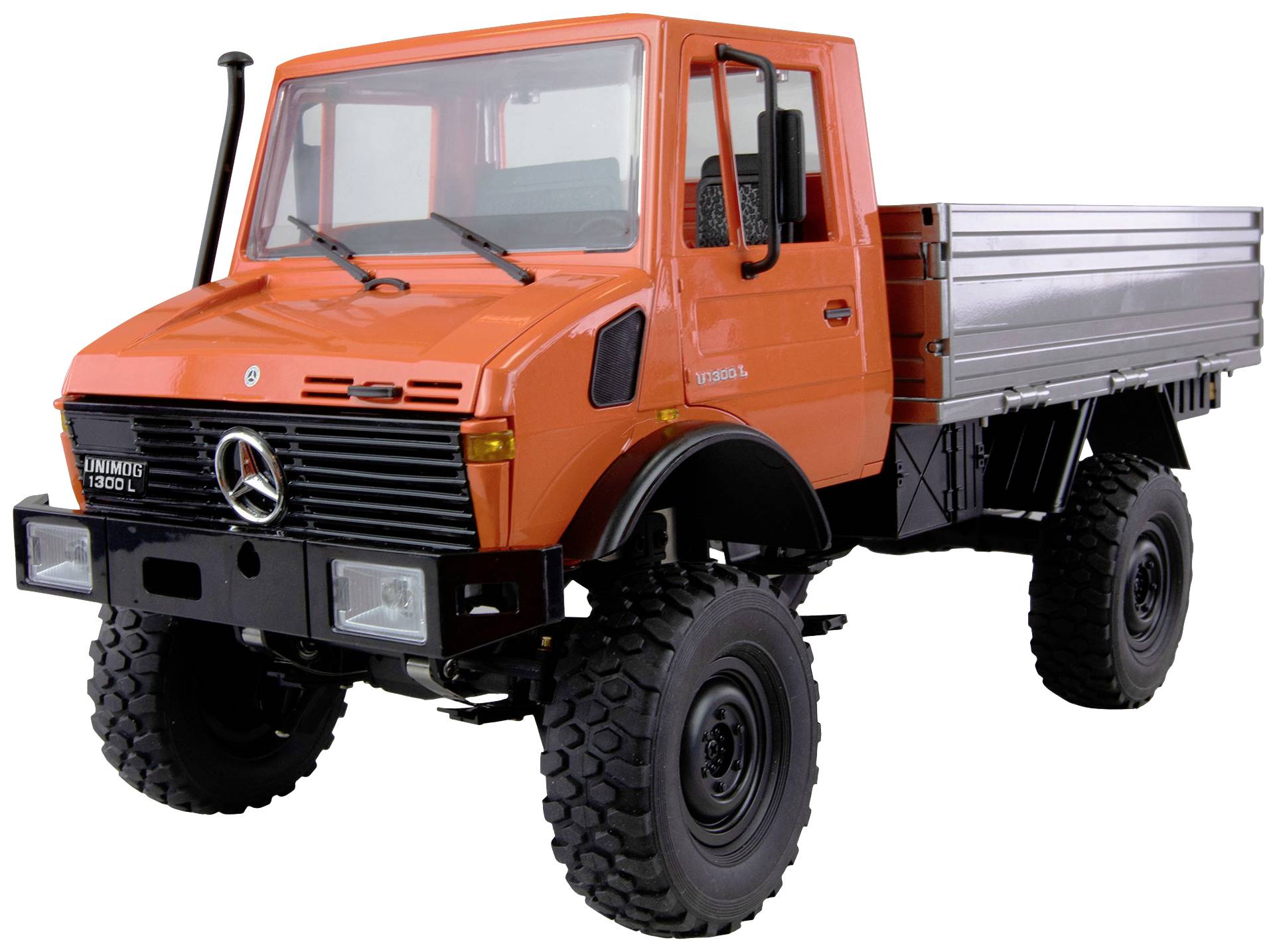 An orange lorry with robust tyres, suitable for rough terrain, stands upright. Mercedes logo visible on the front.