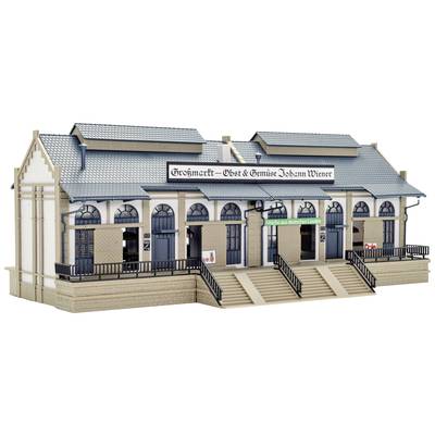 A model building of a wholesale market with the inscription 'Wholesale Market - Fruit & Vegetables Johann Wieser'. It shows details such as windows and stairs.