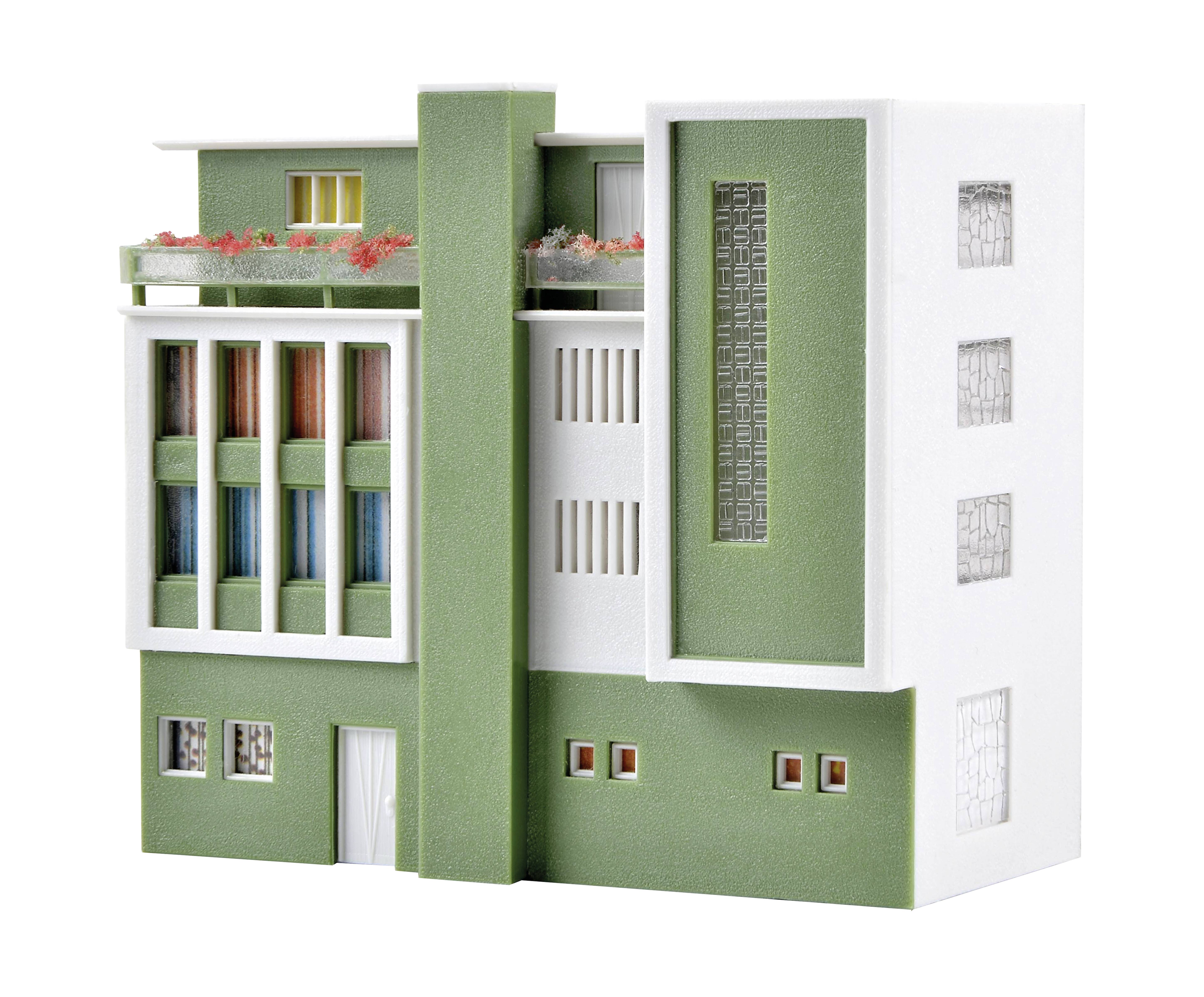 A modern, green building model with white details, slim windows, and a planted balcony. Architecturally minimalist and stylish.