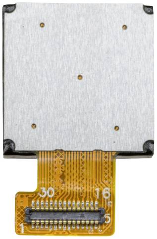 A small square electronic chip with an orange flexible circuit board and a connector on its underside.