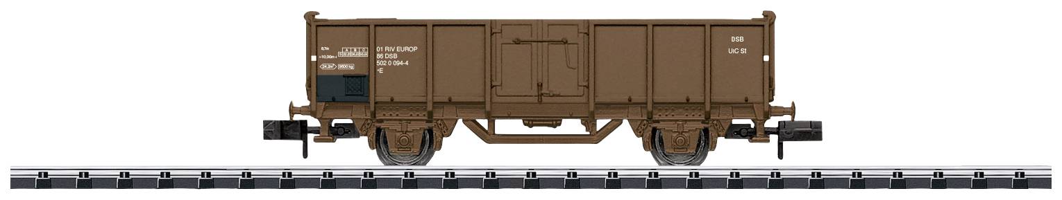 Brown goods wagon on railway tracks, side view.
