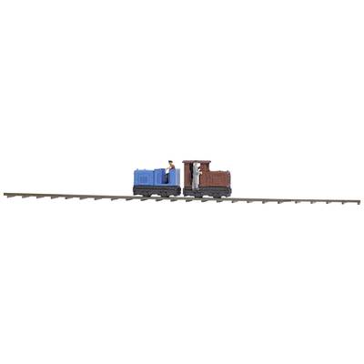 Two miniature railway locomotives on a track, one in blue and one in brown, are travelling in opposite directions.