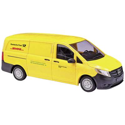 Yellow delivery van of Deutsche Post with DHL logo, viewed from the side, on a white surface.