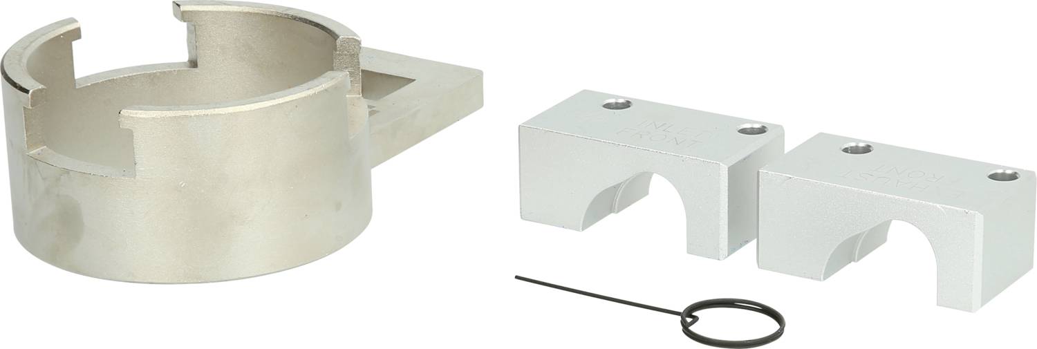 Metal parts and fastening elements, including two silver blocks and a ring. Potentially for mechanical or industrial applications.