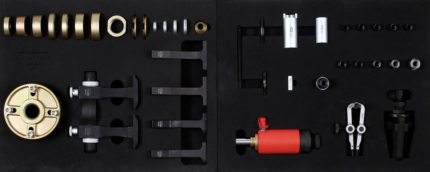 A tool set for removing wave bearings, containing various adapters and pullers, neatly arranged in a case.