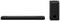 Black soundbar and subwoofer on a white background. The soundbar is flat and rectangular, while the subwoofer is tall and cylindrical.