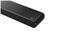 Black soundbar with rounded edges and perforated grille surface. Upper corner segment on white background.