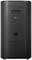 Black, cylindrical speaker by LG, with connections on the back and a simple, modern design.