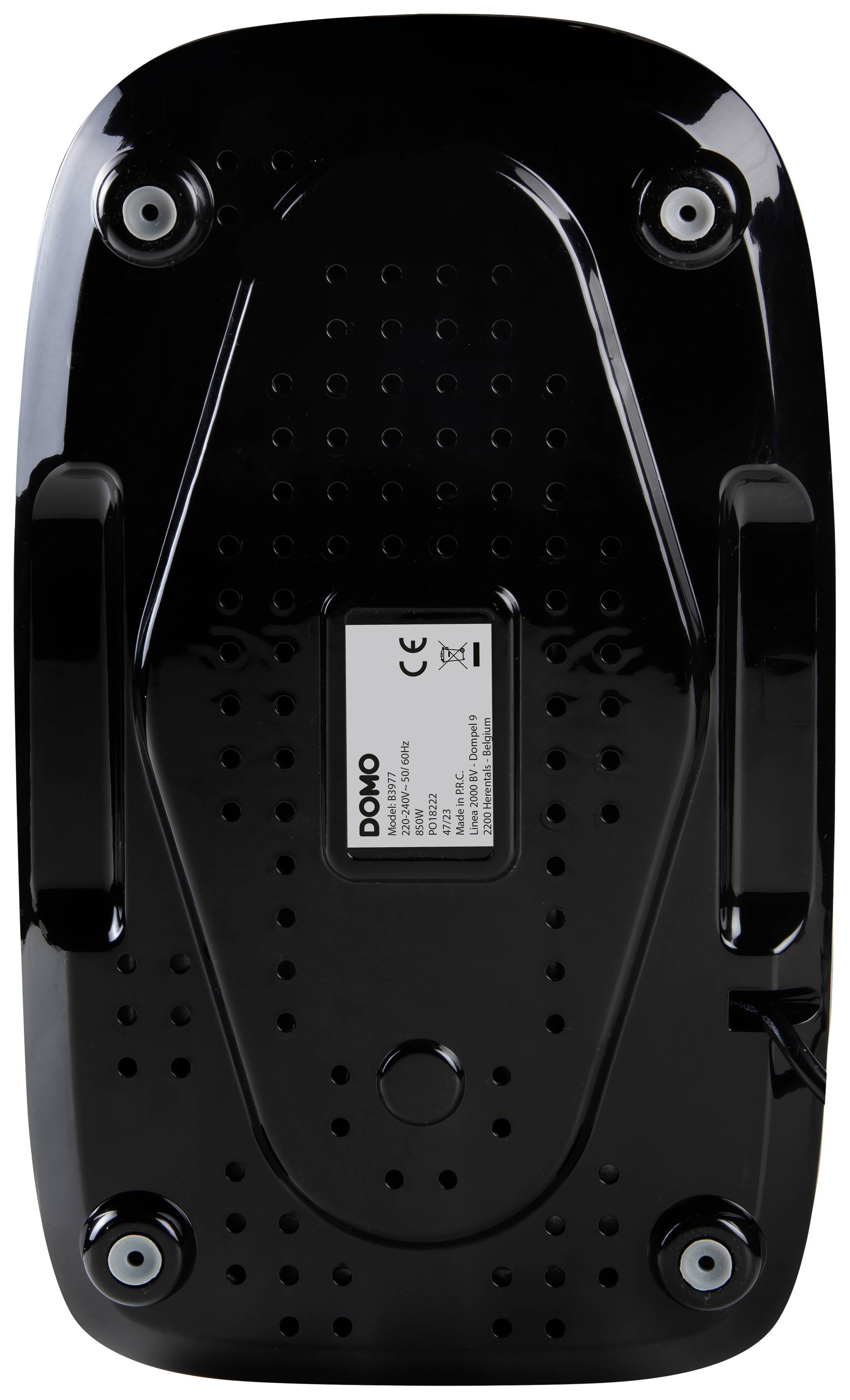 Black, rectangular base of a device with four round rubber feet and a central label displaying technical specifications.