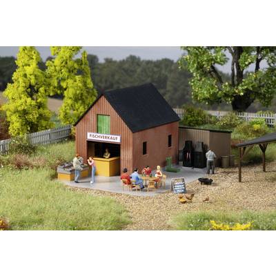 A model of a fish shop in a rural setting, with figures purchasing fish and a board displaying the text 'Freshly smoked today'.