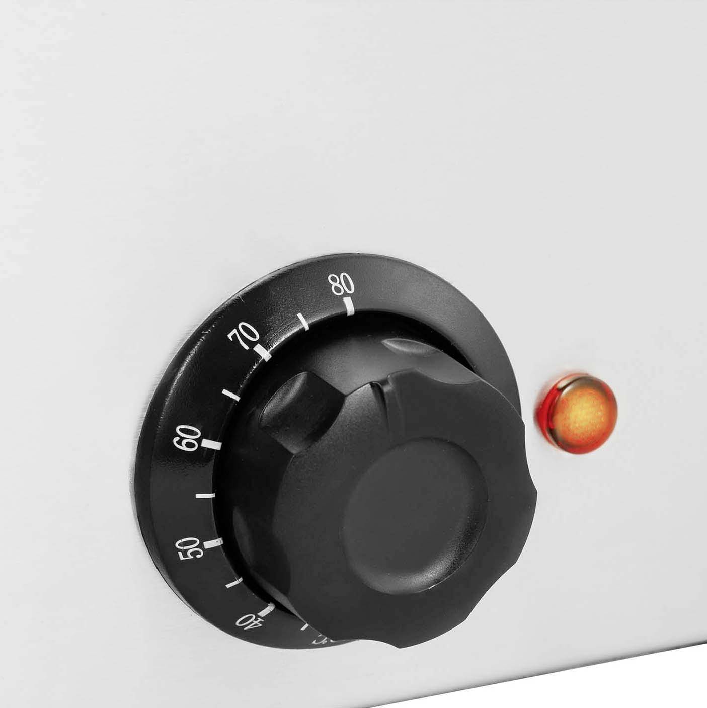 A black rotary dial with a scale from 0 to 80 on a white background, with a red indicator light beside it.