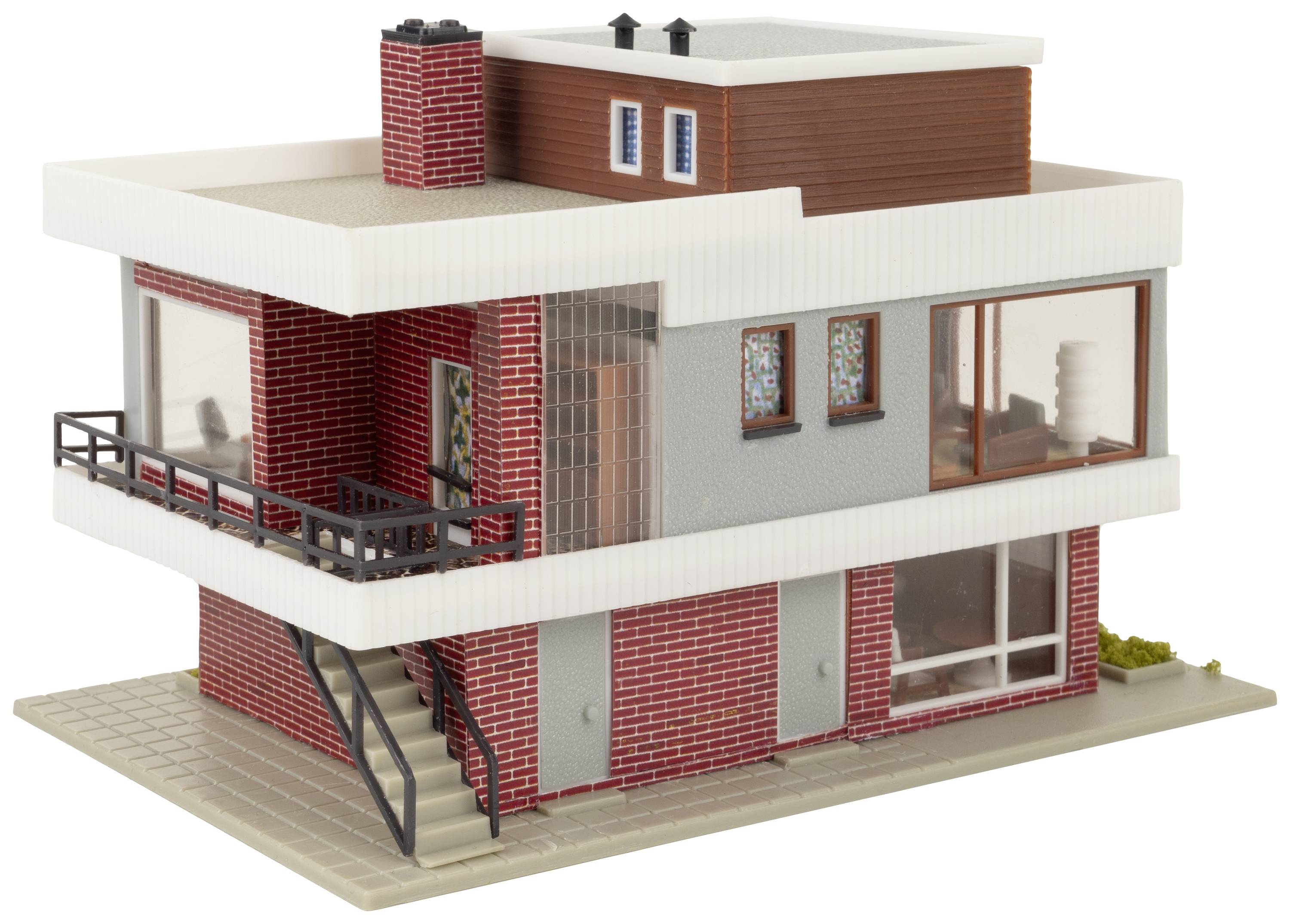 Two-storey model house in the Bauhaus style with a flat roof, large windows, and red brick. Modern architecture, minimalist design.